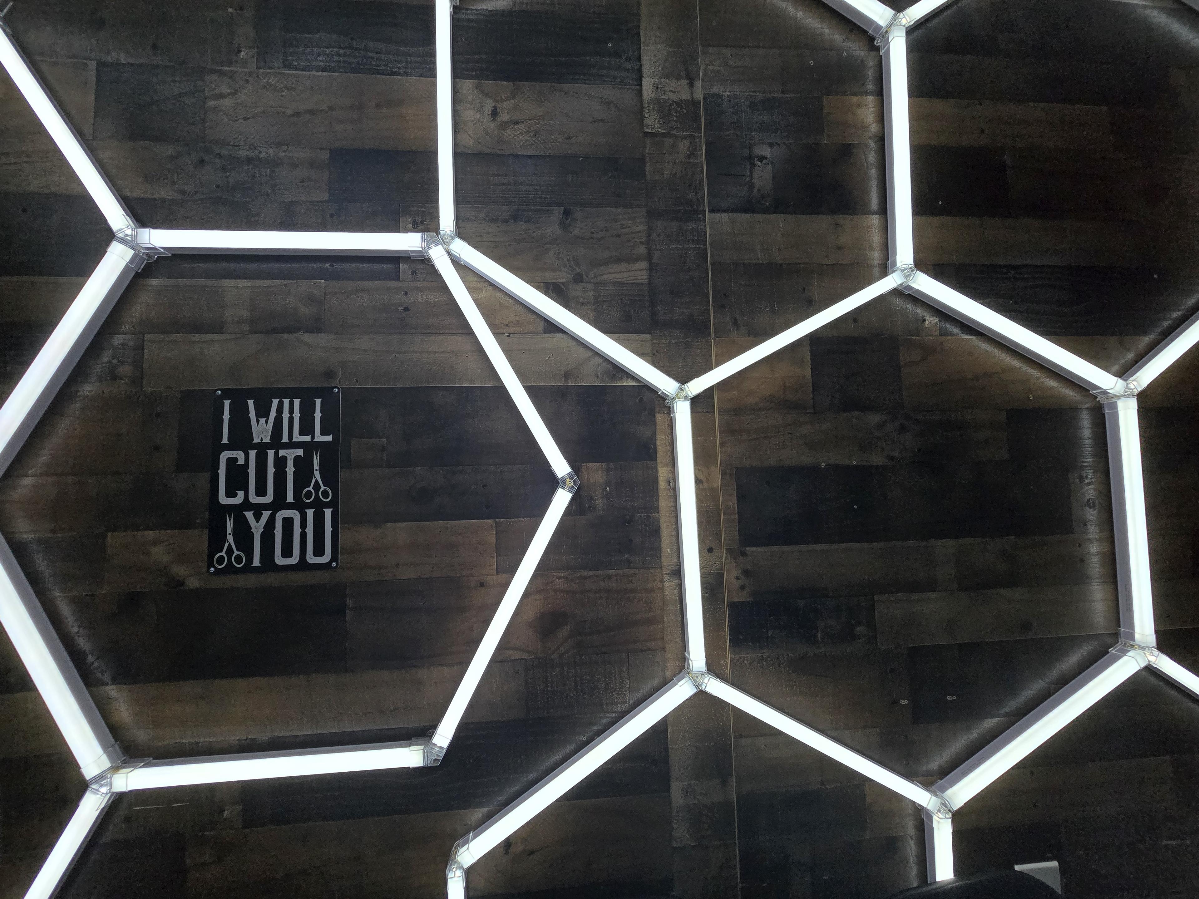 Emmanuel's Barbershop interior with hexagonal LED lights